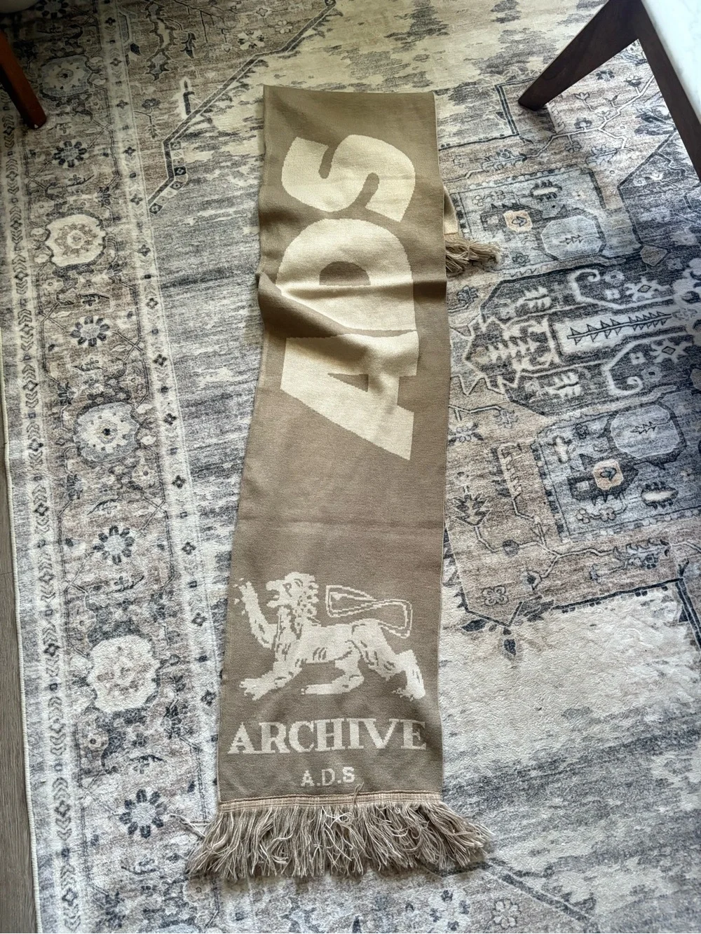 ASOS DESIGN knit Archive graphic scarf in neutral lion
